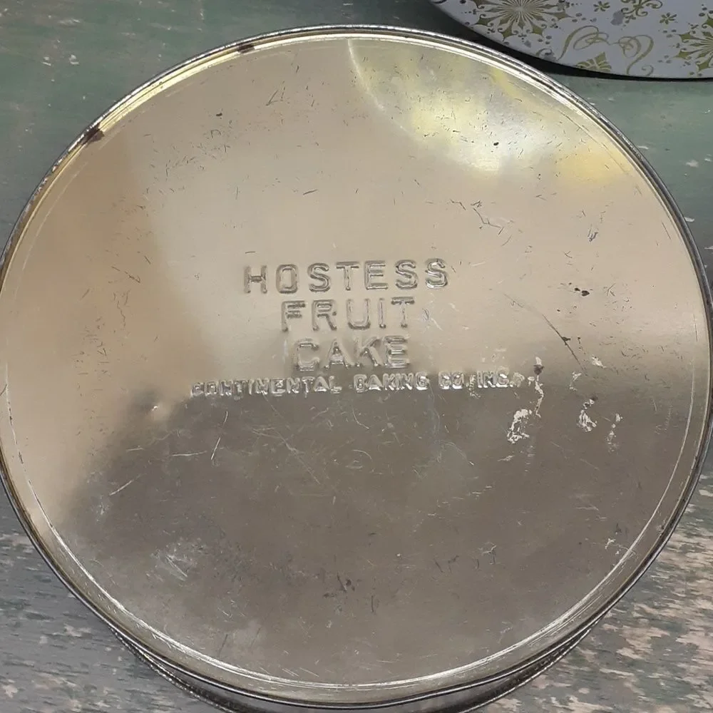 3 pc set of vintage round tins featuring elaborate ladies from the past.